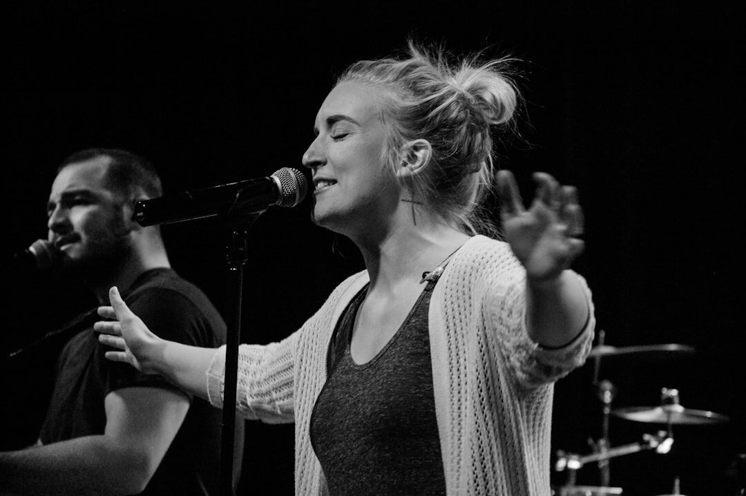 woman singing on stage