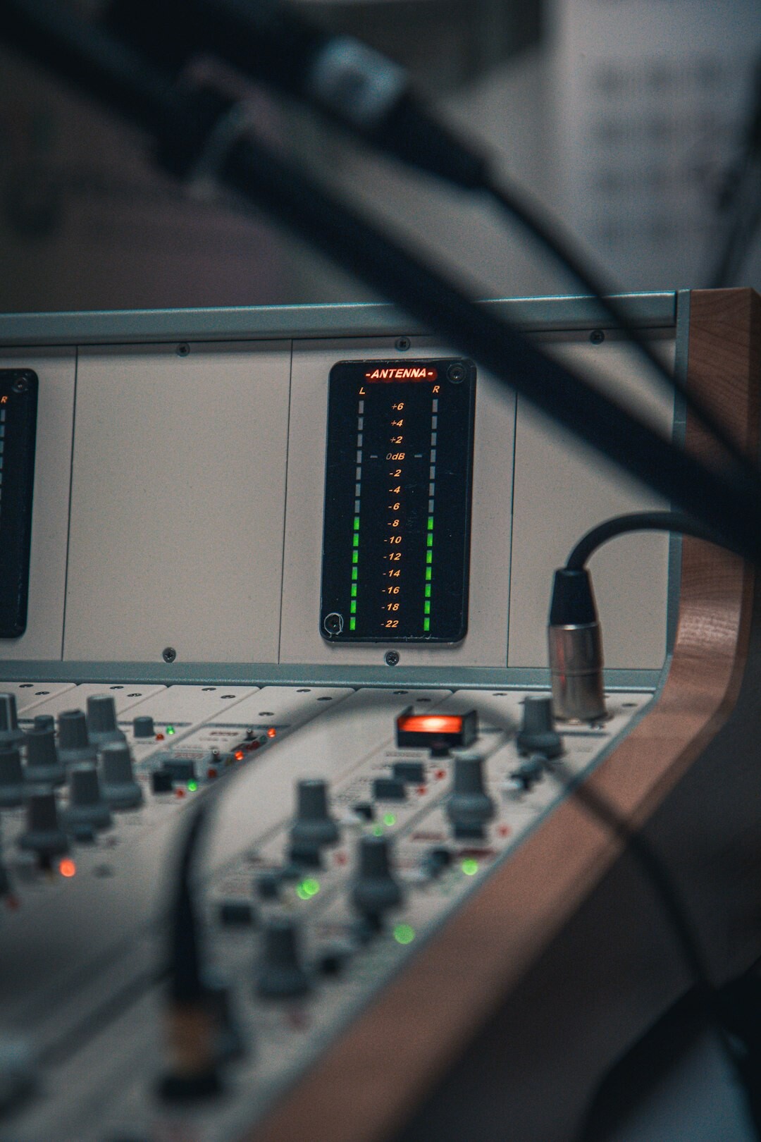 Radio host speaking into a microphone in a broadcast studio