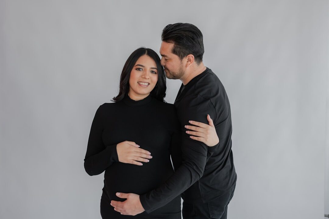 pregnant woman smiling with partner